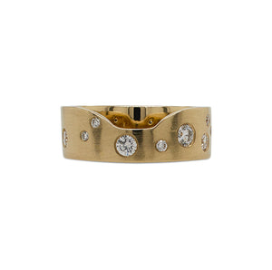 
                  
                    Load image into Gallery viewer, Front view of a notched out cigar band scattered with approx 0.62 ct of burnish set round cut diamonds cast in 14 kt yellow gold.
                  
                