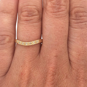 
                  
                    Load image into Gallery viewer, Princess cut diamond shadow band set in 14 kt yellow gold on left ring finger.
                  
                