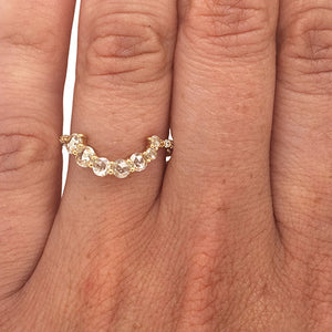 
                  
                    Load image into Gallery viewer, Asymmetrical, rose cut diamond shadow band with 7 rose cut diamonds and 10 round cut diamonds set in 14 kt yellow gold on left ring finger for scale.
                  
                