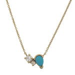 Front view of a necklace featuring two round cut diamonds set to one side of a pear cut turquoise stone set in 14 kt yellow gold.