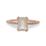 Front view of an emerald cut moonstone and diamond ring cast in 14 kt rose gold by King + Curated.