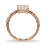 Side view of an emerald cut moonstone and diamond ring cast in 14 kt rose gold by King + Curated.