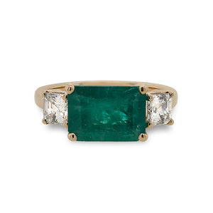 
                  
                    Load image into Gallery viewer, Front view of Columbian emerald ring flanked with 2 asscher cut diamonds set in 14 kt yellow gold.
                  
                