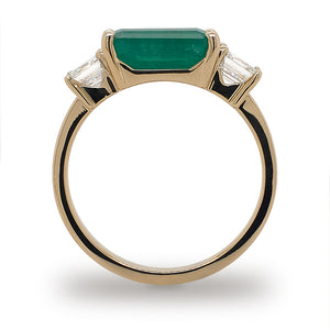 
                  
                    Load image into Gallery viewer, Side view of Columbian emerald ring flanked with 2 asscher cut diamonds set in 14 kt yellow gold.
                  
                