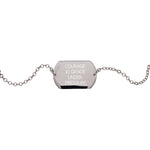 Front view of sterling silver dog tag with bracelet chain connected at each end with the engraving "COURAGE IS GRACE UNDER PRESSURE.". 