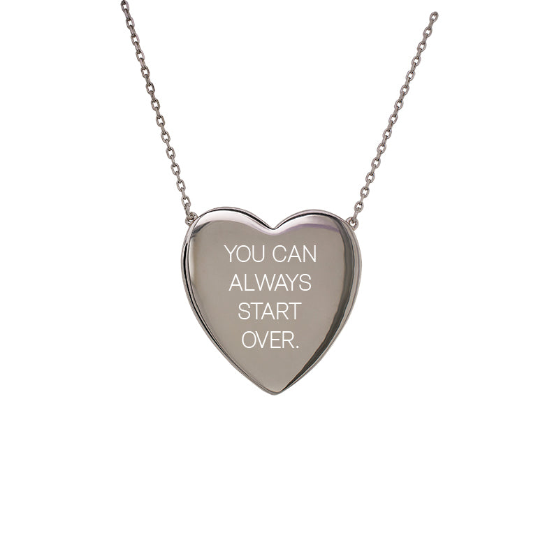 
                  
                    Load image into Gallery viewer, Front view of a heart pendant stationary set on fine chain with the engraving &amp;quot;YOU CAN ALWAYS START OVER.&amp;quot;. Heart measures 24mm x 24mm.
                  
                