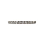 Front view of a half eternity band with round cut diamonds cast in 14 kt white gold.