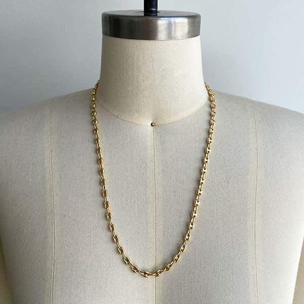 Front view of small mariner 20" chain on dress form. Cast in 14kt yellow gold.
