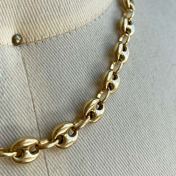 Close up view of larger mariner link necklace, cast in 14kt yellow gold.