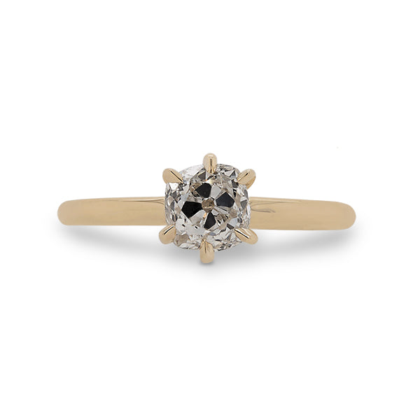 Front view of a 6 prong, miner cut diamond ring cast in 14 kt yellow gold.