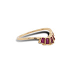 Side view of modern ruby ring with 5 bezel set rubies set in 14 kt yellow gold.