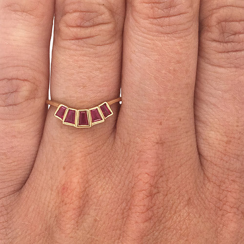 
                  
                    Load image into Gallery viewer, Modern ruby ring with 5 bezel set rubies set in 14 kt yellow gold on left ring finger.
                  
                
