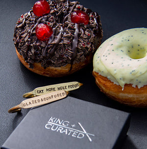 
                  
                    Load image into Gallery viewer, Two brass cuffs and donuts from the  King + Curated and NoFoDoCo collaboration .
                  
                