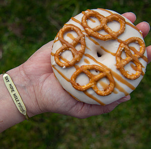 
                  
                    Load image into Gallery viewer, Brass cuff and donut from the  King + Curated and NoFoDoCo collaboration .
                  
                