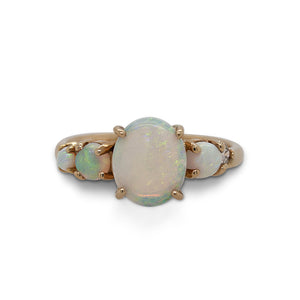 
                  
                    Load image into Gallery viewer, Front view of an asymmetrical opal and diamond ring cast in 14 kt yellow gold.
                  
                