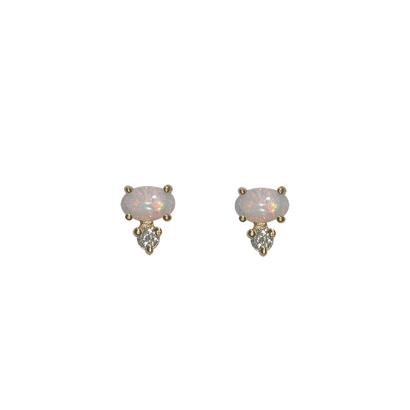 
                  
                    Load image into Gallery viewer, Front view of white oval opals, set east-west in 14 kt yellow gold with 1 round accent diamond set vertically below each.
                  
                