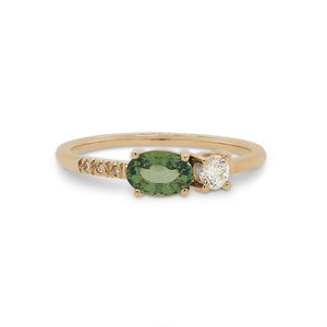 
                  
                    Load image into Gallery viewer, Front view of an asymmetrical oval cut, green sapphire and diamond ring cast in 14 kt yellow gold by King + Curated.
                  
                