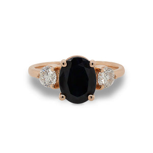 
                  
                    Load image into Gallery viewer, Front view of oval cut black sapphire and round cut diamond ring set in 14 kt rose gold.
                  
                
