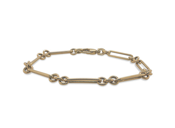 
                  
                    Load image into Gallery viewer, Front view of a paperclip and triple ring style bracelet made of solid 14 kt yellow gold.
                  
                