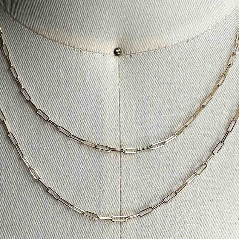 
                  
                    Load image into Gallery viewer, Close up of one 16&amp;quot; and one 18&amp;quot; 14 kt solid gold paperclip style chain necklace on a body form for scale.
                  
                