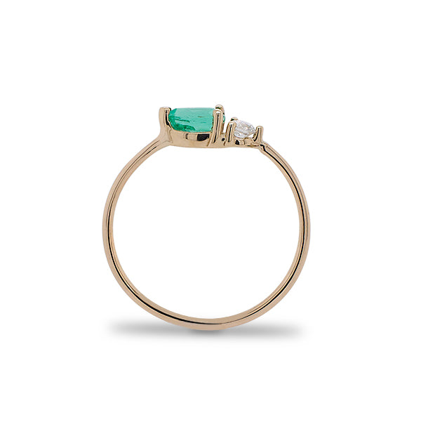 
                  
                    Load image into Gallery viewer, Side view of pear cut emerald and round diamond ring cast in 14 kt yellow gold.
                  
                
