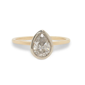 
                  
                    Load image into Gallery viewer, Front view of a bezel set, pear cut, salt and pepper diamond solitaire ring cast in 14 kt yellow gold by King + Curated.
                  
                