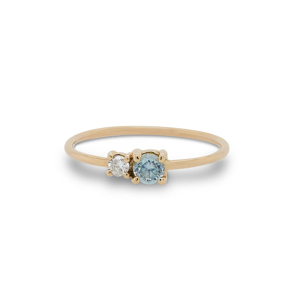
                  
                    Load image into Gallery viewer, Front view of round cut blue zircon and diamond ring cast in 14 kt yellow gold.
                  
                