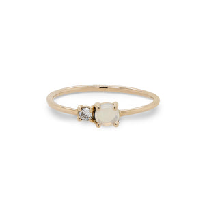 
                  
                    Load image into Gallery viewer, Front view of petite moonstone and round diamond ring set in 14 kt yellow gold.
                  
                