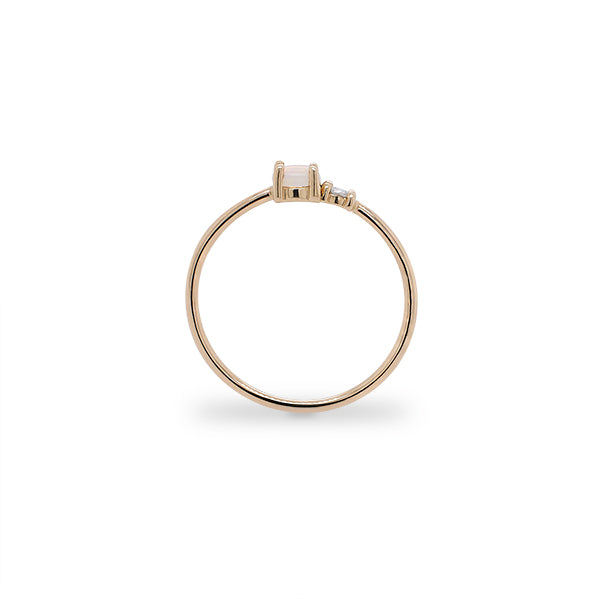 
                  
                    Load image into Gallery viewer, Side view of petite moonstone and round diamond ring set in 14 kt yellow gold.
                  
                