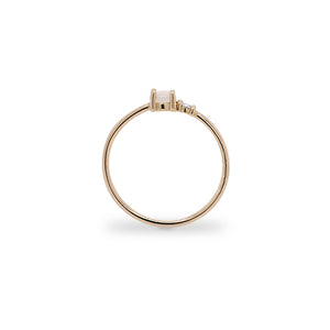 
                  
                    Load image into Gallery viewer, Side view of petite moonstone and round diamond ring set in 14 kt yellow gold.
                  
                