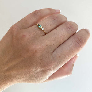 
                  
                    Load image into Gallery viewer, Pear cut, green tourmaline and diamond ring cast in 14 kt yellow gold on left ring finger.
                  
                