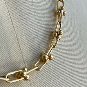 
                  
                    Load image into Gallery viewer, close up view of larger pinball chain links in 14kt yellow gold.
                  
                