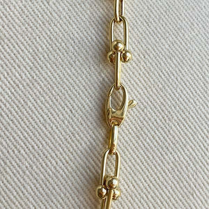 
                  
                    Load image into Gallery viewer, Close up view of lobster clasp on 14kt yellow gold pinball chain.
                  
                