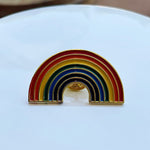 Front view of an enamel rainbow shaped pin.