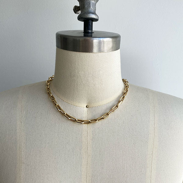 Front view of paperclip chain on dress form Shown at shortest necklace length. Chain is cast in 14kt yellow gold.