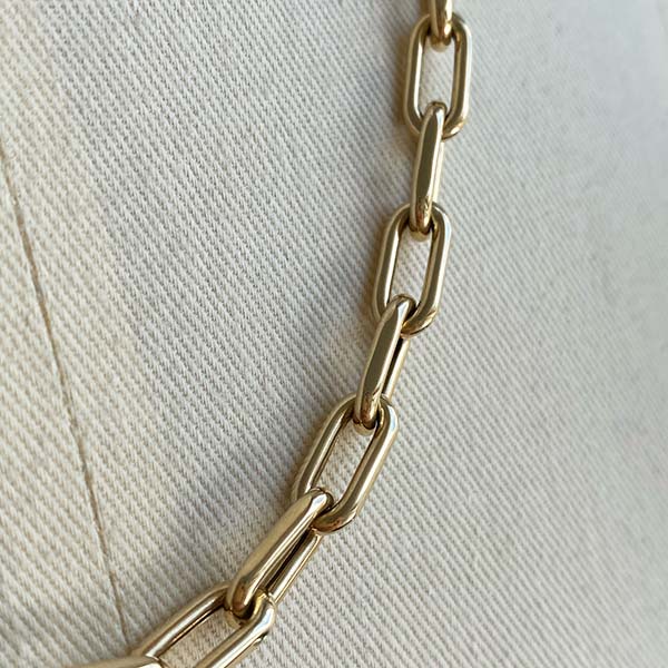 
                  
                    Load image into Gallery viewer, Close up of paperclip chain links in 14kt yellow gold.
                  
                