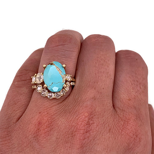 
                  
                    Load image into Gallery viewer, Asymmetrical, rose cut diamond shadow band with 7 rose cut diamonds and 10 round cut diamonds set in 14 kt yellow gold stacked against a turquoise and rose cut diamond band on left ring finger for scale.
                  
                