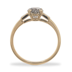 
                  
                    Load image into Gallery viewer, Side view of a round cut salt and pepper diamond ring flanked by 2 baguette cut diamonds, and cast in 14 kt yellow gold.
                  
                