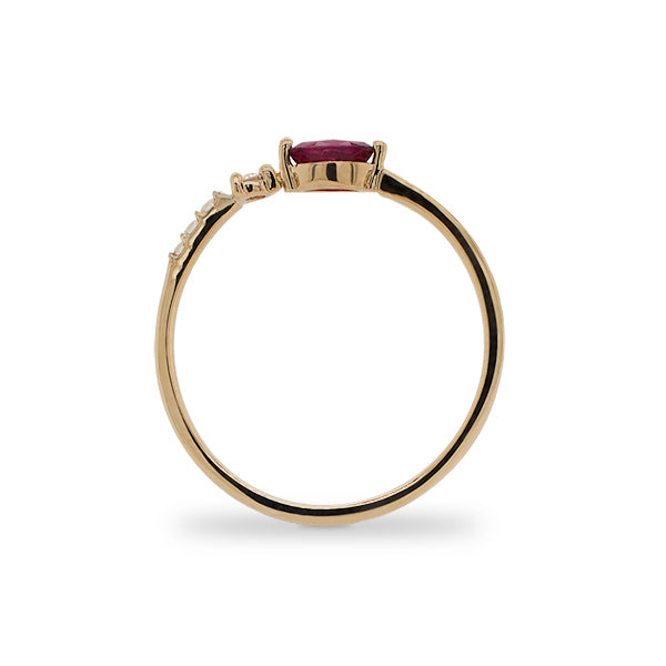 Side view of marquise cut ruby and diamond ring cast in 14 kt yellow gold.