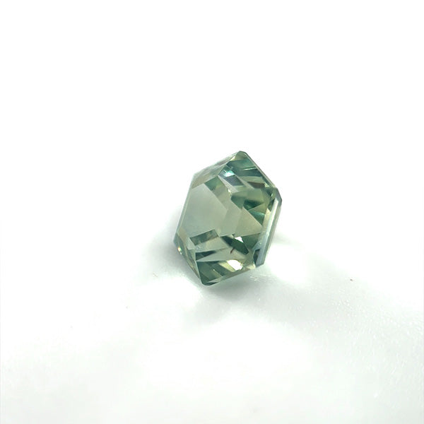 
                  
                    Load image into Gallery viewer, 3/4 view of 1.13 green-blue hexagon cut sapphire on white background.
                  
                