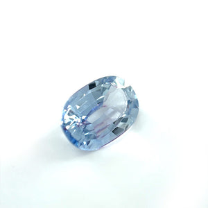 
                  
                    Load image into Gallery viewer, 3/4 view of 1.46 ct. light blue-violet and elongated oval sapphire on white background.
                  
                