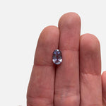 Front view of 1.46 ct. light blue-violet and elongated oval sapphire on ladies hand for scale.