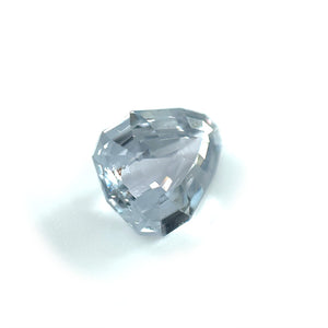 
                  
                    Load image into Gallery viewer, Angled view of a 2.08 ct. geometric pear-shaped shield cut grey sapphire on white background.
                  
                