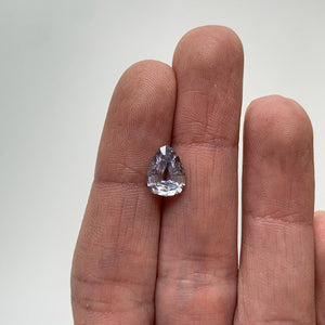 
                  
                    Load image into Gallery viewer, View of a 2.08 ct. geometric pear-shaped shield cut grey sapphire in ladies hand for scale.
                  
                