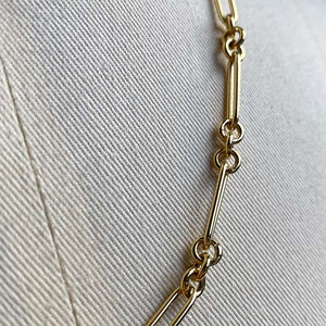 
                  
                    Load image into Gallery viewer, Close up image of smaller paperclip chain with 3 round link in 14kt yellow gold.
                  
                