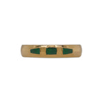 Front view of 4.6mm wide and rounded band with 3 inlays of malachite, rectangular in shape in the middle and tapered on either side. Cast in 14kt yellow gold.