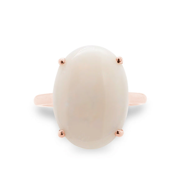 Front view of oval cut, 4 prong, 2.76 ct opal ring set in 14 kt rose gold.