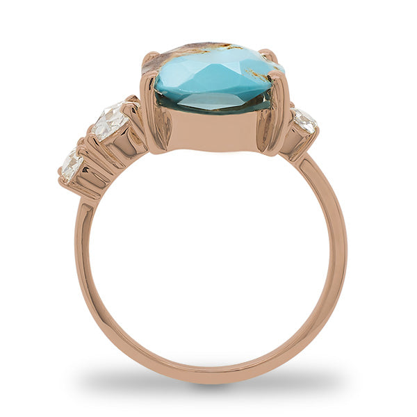 
                  
                    Load image into Gallery viewer, Side view of an asymmetrical rose cut turquoise ring flanked by 3 rose cut diamonds cast in 14 kt rose gold by King + Curated.
                  
                
