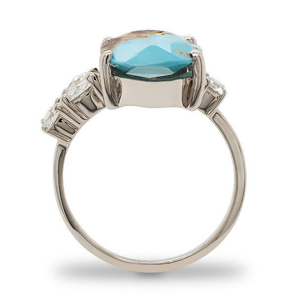 
                  
                    Load image into Gallery viewer, Side view of an asymmetrical rose cut turquoise ring flanked by 3 rose cut diamonds cast in 14 kt white gold by King + Curated.
                  
                