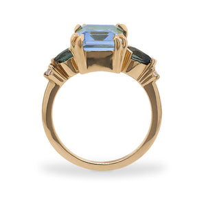 
                  
                    Load image into Gallery viewer, Side view of a large, emerald cut topaz, tourmaline and diamond ring cast in 14 kt yellow gold.
                  
                